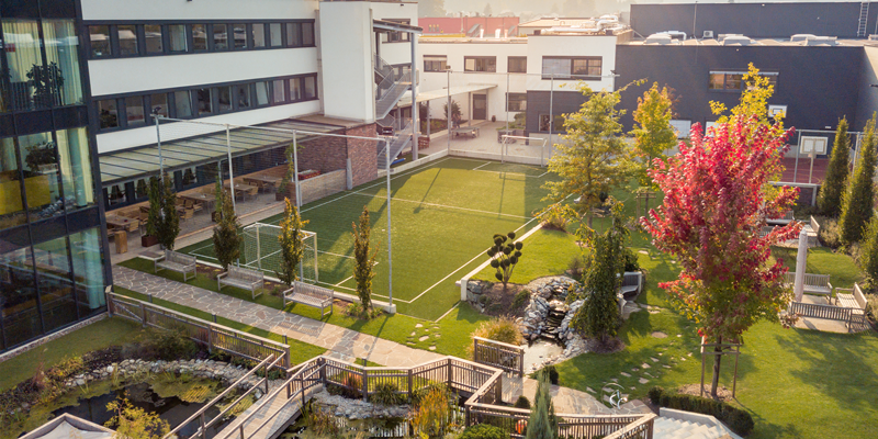 Garden from LOGICDATA Headquaters - view of the soccer field, pond and basketball court